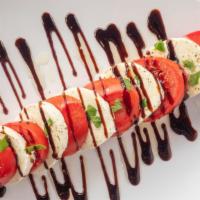 Caprese · Thick slices of mozzarella, fresh sliced tomatoes, fresh basil, drizzled with olive oil and ...