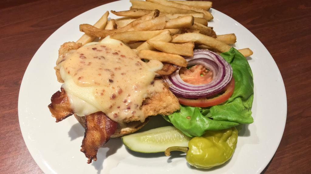 Honey Mustard Chicken Sandwich · Crispy or grilled chicken, melted Swiss and smoked-bacon
with lettuce, tomato, onion & honey-mustard sauce on a
warm pretzel roll