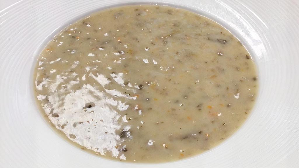 Palazzo Mushroom Soup · Mixed mushrooms in a creamy broth, finished with a splash of sherry wine.