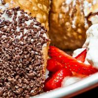 Two Cannolis · Two classic cannoli shells filled with our house made pastry cream and dipped in almonds and...
