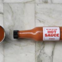 House Hot Sauce · A drunken buffalo hot sauce made in house with a blend of chipotle, chile de arbol, and caye...