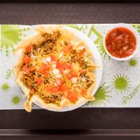 Ground Beef Taco Salad · A fried flour tortilla bowl with lettuce, onions, seasoned ground beef, cheese, tomatoes, an...