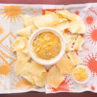 Bowl Of Green Chili · A bowl of our famous green chili and cheese, with a side of fresh fried tortilla chips.