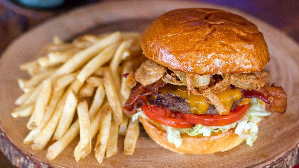 The Moose Is Loose Burger · Wisconsin aged cheddar, Applewood smoked bacon, onion straws, shredded lettuce, sliced tomato and Smilin' Moose burger sauce.