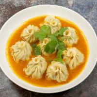 Jhol Momo (8) · Eight pieces of made from scratch momos steamed Kathmandu valley-style dumpling stuffed with...