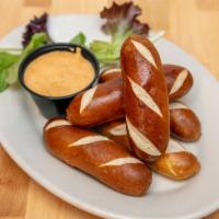 Pretzels & Queso · Warm pretzels served with our zesty queso.