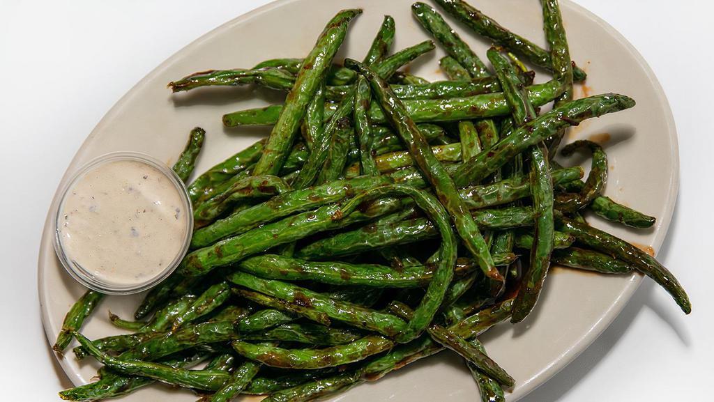 Szechwan Green Beans · Pan-seared fresh green beans lightly coated with seasonings and szechwan sauce served with Parmesan peppercorn ranch.