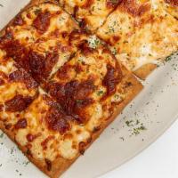 Buffalo Flatbread · New! Shredded chicken, blended with cream cheese, ranch, blue cheese, and buffalo sauce topp...