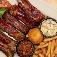 Bbq Ribs · The house specialty! Hickory smoked St. Louis style dry rub ribs served with baked beans, cr...