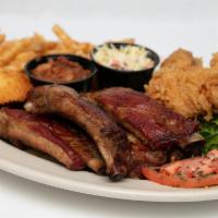 Rib Combo Platter · Four bones of hickory smoked St. Louis style dry rub ribs with your choice of broasted chick...