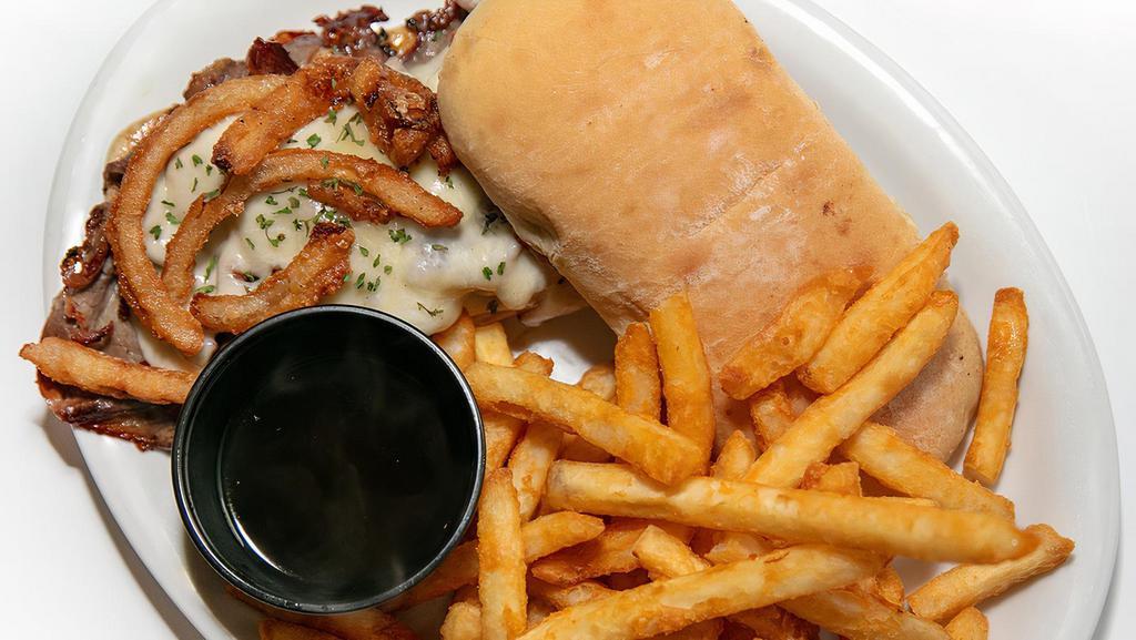 Shaved Prime Rib Sandwich · Fresh shaved prime rib topped with melted provolone, onion strings and your choice of au jus or horseradish sauce.
