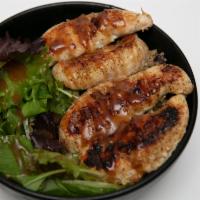 Sesame Chicken · Tender grilled chicken, ancient grains, rice, black beans, and greens topped with baby arugu...