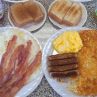 No 1.  Breakfast Special · With choice of HAM, 4 BACON or  4 SAUSAGE, choice of HASH BROWNS  or GRITS, TOAST and jelly.