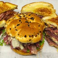 Corned Beef Sandwich · With mustard, pickles and SWISS cheese RYE or an ONION ROLL.