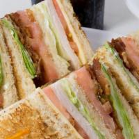 Club Sandwich · With HAM, TURKEY and BACON , lettuce, tomatoes and mayo.