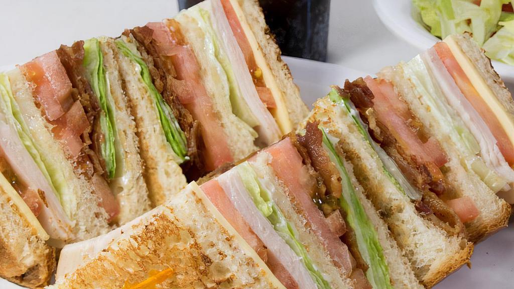 Club Sandwich · With HAM, TURKEY and BACON , lettuce, tomatoes and mayo.