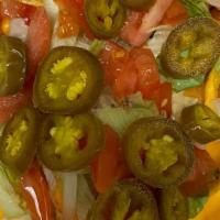 Large Nachos Supreme · Tortilla chips, chili, lettuce, tomatoes, cheese, olives, ground beef and hot peppers, serve...