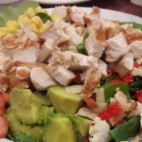 Santa Fe Chicken Salad · Fresh mixed greens topped with grilled chicken breast strips, avocado, corn, black beans, to...