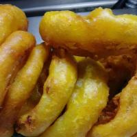 Onion Rings · Sliced, battered tempura style, and fried fresh daily.