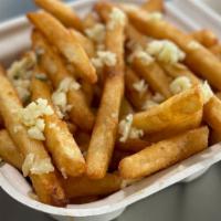 Reg Garlic Fries · French fries tossed in olive oil and sprinkled with parsley and fresh, local garlic.