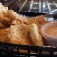 Fried Pickles · Crispy fried dill pickle chips hand breaded to order. Served with our own spicy Bam sauce.