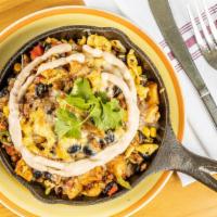Southwest Skillet · Onions, red peppers, sweet corn, jalapeños, eggs, black beans, potatoes, heddar, chipotle ma...