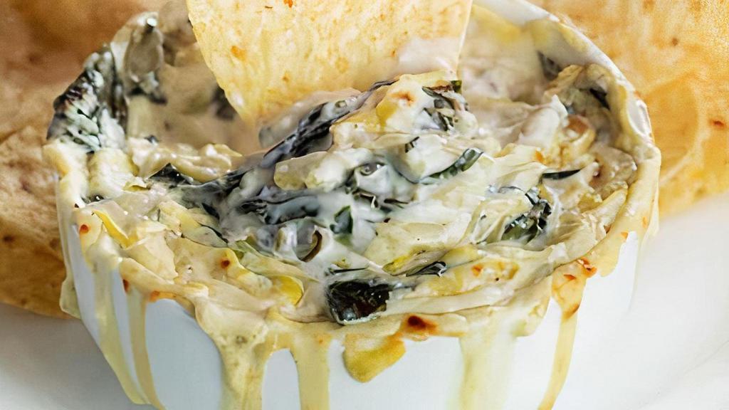 Spinach & Artichoke Dip · homemade artichoke & cheese dip served with tortilla chips