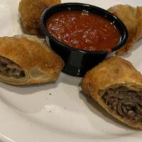 “What’S Your Beef?” Roll · Italian beef, hot giardiniera and cheese rolled up in a lite flaky crust served with marinar...