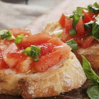 Bruschetta · grilled garlic bread topped with tomatoes, oil, garlic, & basil