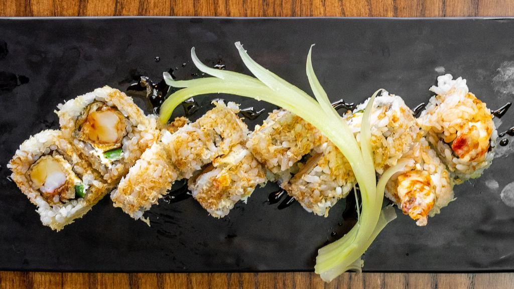 Crunchy Roll · Shrimp tempura, cream cheese, jalapeno, rolled in tempura flakes. Eel sauce