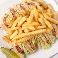 Club House · White toast with three layers of turkey, bacon, american cheese, lettuce, tomato and mayo.