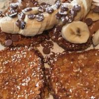 Crunchy Monkey · Four pieces of our signature crunchy French toast cooked to perfection and layered with choc...