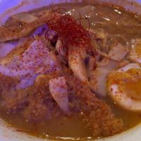 Spicy Ramen Noodle Bowl · Your choice of katsu chicken or char sui pork atop curly egg noodles, bamboo shoots, scallio...