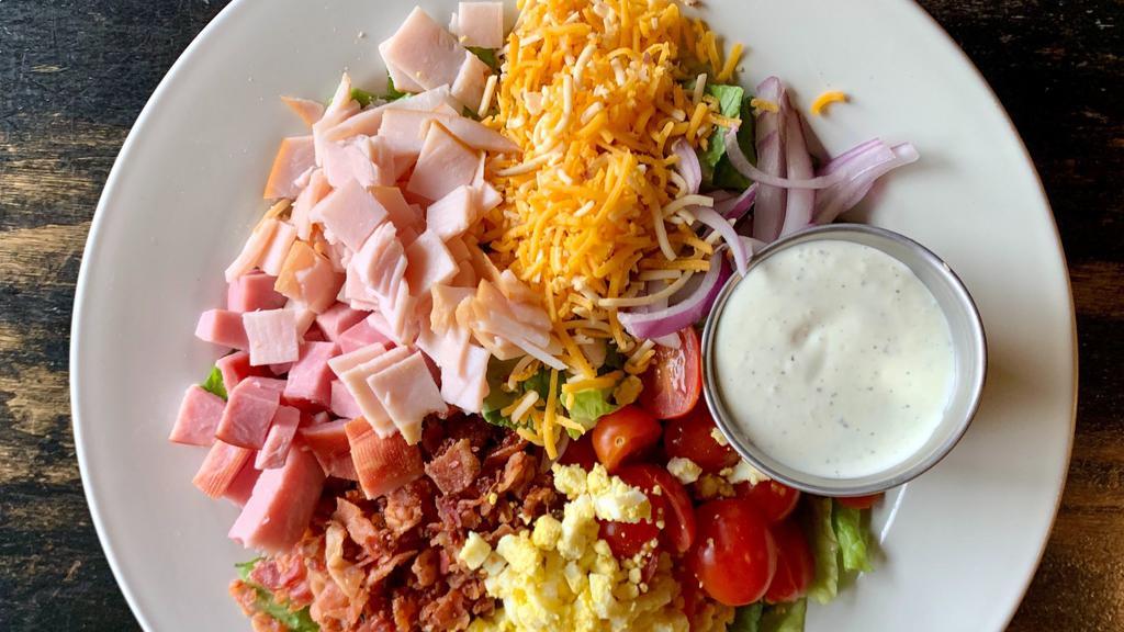 Chef Salad · Mixed Greens, Tomato, Red Onion, Boars Head Ham & Turkey, Bacon, Big Ass Cheese Blend, Hard Boiled Egg, Ranch Dressing.