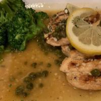 Chicken Piccata · Sautéed chicken in white wine, garlic and lemon with capers. Served with vegetables, pasta o...