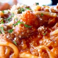 Spaghetti Bolognese · Spaghetti in an authentic Northern-Italian meat ragù topped with parmigiano.