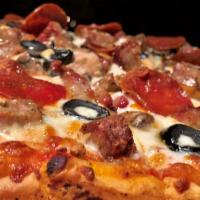 Tutta · Mozzarella, Italian sausage, pepperoni, black olives, onions, mushrooms, gorgonzola