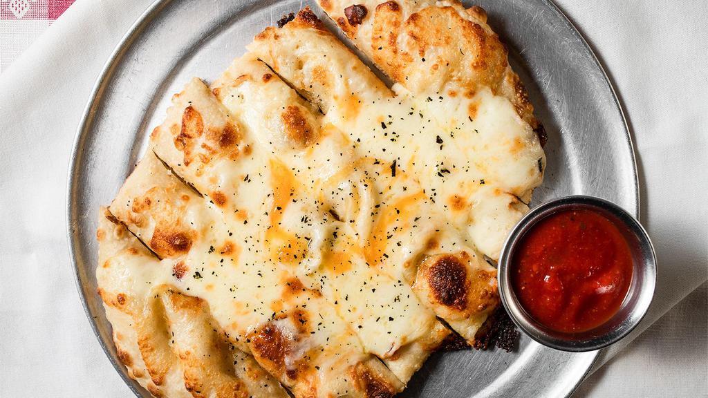 Garlic Cheese Ropes (3 Pc) · Vegan. Our seasoned dough. Topped with fresh cut mozzarella and hand cut parmesan cheese, garlic infused butter. Served with marinara sauce.