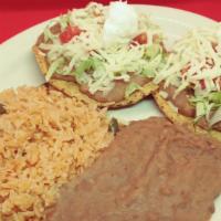 Tostada Dinner (Dinner) · A flat fried corn tortilla with your choice of meat, topped with lettuce, tomato, shredded c...