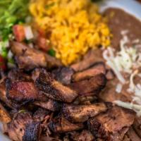 Carnitas Dinner · Slow cooked fried pork, served with rice, bean, pico de gallo, guacamole, jalapenos and corn...