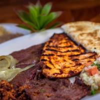 Camino Real Mixed Grill · Grilled steak, chicken, and chorizo served with rice, beans, guacamole, pico de gallo, grill...