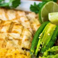 Parrilla De Pollo · Grilled lightly marinated chicken breast served with rice, beans, guacamole, pico de gallo, ...