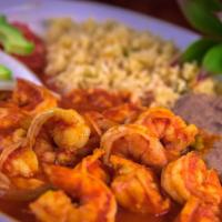 Camarones A La Diabla · Sauteed shrimp cooked with onion and green pepper in a spicy traditional red sauce, served w...