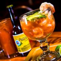 Shrimp Cocktail · Fresh shrimp served in a cocktail glass with a camino real style virgin bloody mary mix, cho...