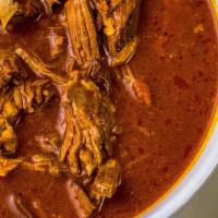 Birria · A authentic mexican stew prepared with beef, marinated in adobo spices traditionally served ...