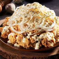 Snow Onion · Savory and Creamy. Fried Chicken topped off with our signature snow sauce and raw onions.