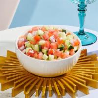 Israeli Salad · Diced tomatoes, onions, and cucumbers.