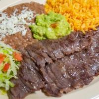 Carne Asada · Arrachera cut,  hand trimmed  grilled skirt steak. Served with fresh guacamole, lettuce, and...