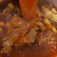 Pozole (32 Oz.) · Pork hominy soup, an Aztec tradition (not spicy) served with cabbage, radish slices, limes, ...