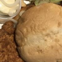 Tenderloin Sandwich · Hand-cut and breaded or grilled with lettuce, tomato, pickle, and onion.